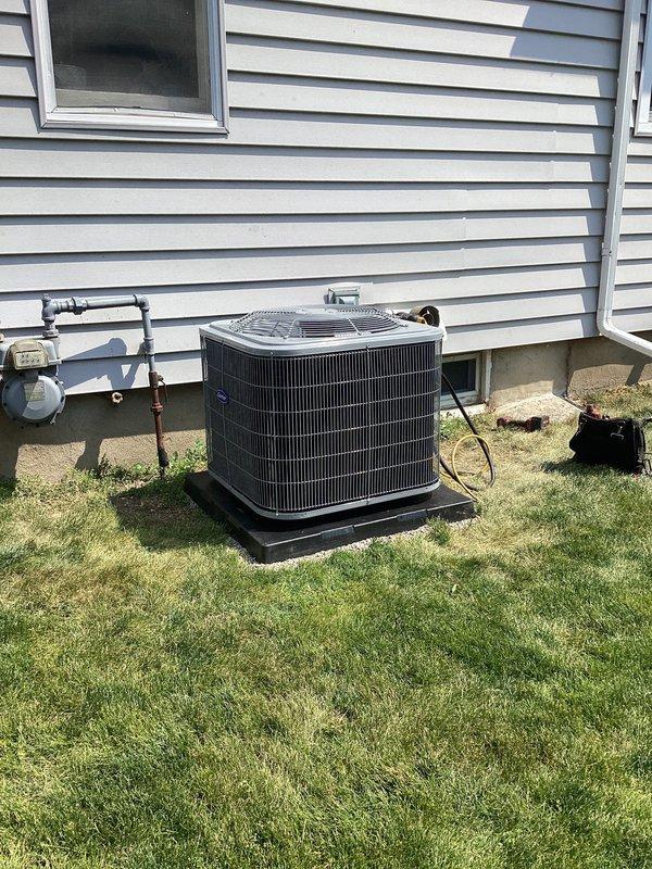 Completed full HVAC system replacement including installation of Carrier 26SCA436N003 Comfort Series single-stage air conditioner and Carrier CVAVA4221XMA evaporator coil. Reconnected system to existing line set after performing flush and pressure test to ensure proper refrigerant flow and system integrity. Installed new 2" PVC condenser pad with pea gravel base for proper unit leveling and drainage, along with new electrical disconnect and whip for code compliance.

Integrated Honeywell T6 thermostat with existing wiring and programmed system parameters for optimal comfort control. Reconnected existing supply and return ductwork to new evaporator coil, ensuring proper airflow and sealed connections. Performed refrigerant charging and system commissioning, verifying pressures and temperatures across both high and low sides using digital manifold gauges. System readings confirmed proper subcooling and superheat values within manufacturer specifications.

Removed and responsibly recycled