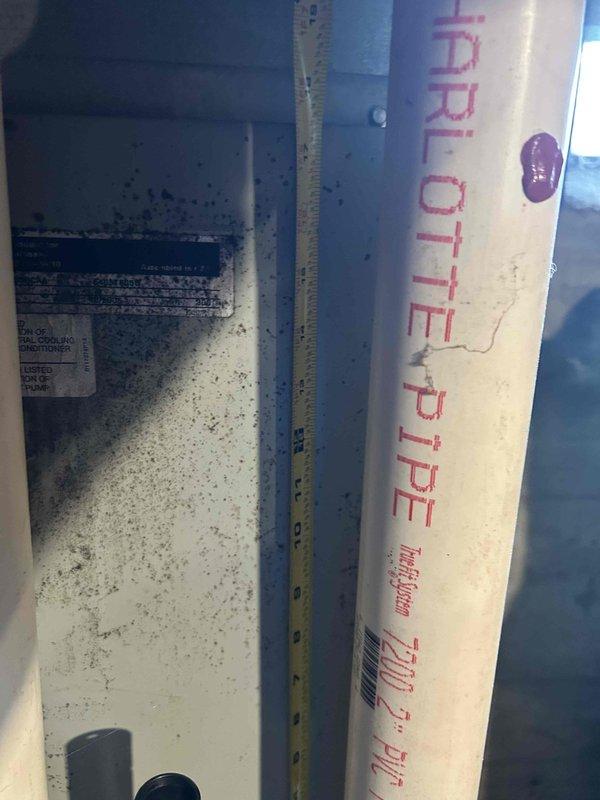 Tech lead Dennis completed an HVAC equipment replacement estimate in a mechanical utility space. Comprehensive measurements and documentation were taken of the existing furnace/air handler unit and associated piping systems, including PVC drainage lines and gas supply connections, to prepare specifications for a complete system replacement.