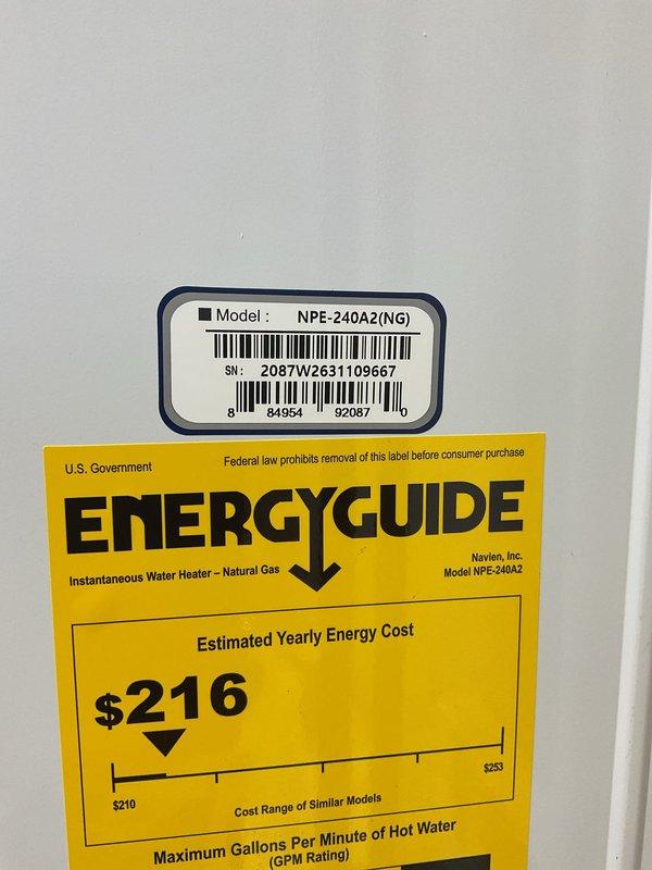 Successfully installed a Navien NPE-240A2 natural gas tankless water heater in the lower level, replacing the existing conventional water heater in the same location. The unit was accessed through outdoor lower level entry, requiring a two-person crew for safe removal of the old equipment and installation of the new tankless system. 

During the installation process, addressed a water leak originating from an outdoor faucet that was penetrating into the basement area. Cut open the interior wall to access and repair the leak source, keeping the opening minimal per customer request to allow for future access panel installation. Completed all necessary plumbing connections, gas line hookup, venting, and electrical requirements for the tankless unit. System was tested, calibrated to 125°F operating temperature, and confirmed in proper stand-by mode with all controls functioning correctly.
