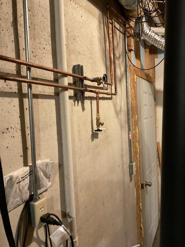 Conducted initial assessment for bathroom lavatory faucet repair requiring Moen single-handle cartridge replacement. Documented existing plumbing conditions in basement utility area showing copper supply lines with shut-off valves. Coordinated with property owner to obtain manufacturer-specific Moen cartridge for installation during follow-up visit, at which time two 1/2" ball valves and two 1/2" boiler drains will be installed and plumbing inspection will be completed.