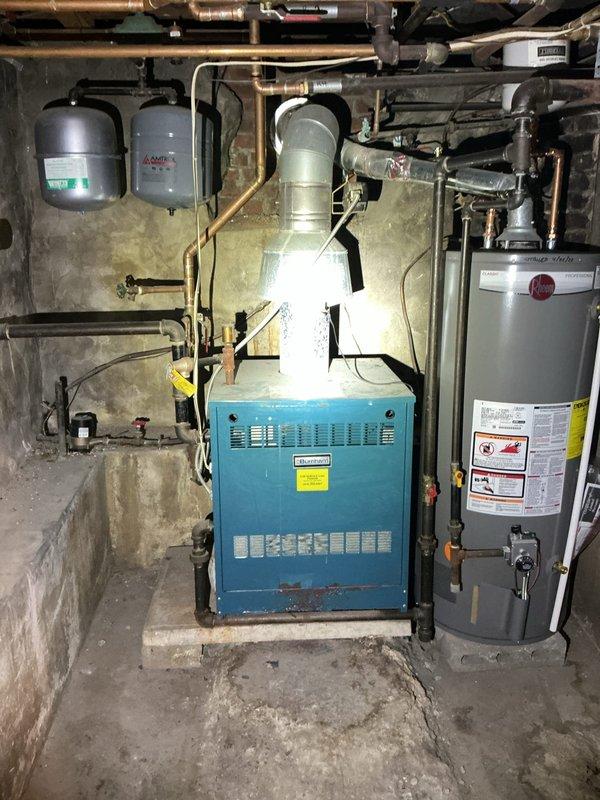 Responded to no cooling call on commercial system requiring 12 pounds of R22 refrigerant. Assessed existing equipment in basement mechanical room, including aging air handler and associated components showing significant wear and rust accumulation. Provided estimate for minimum-specification replacement system as customer requested most economical solution for complete HVAC replacement rather than repair of R22-dependent equipment.