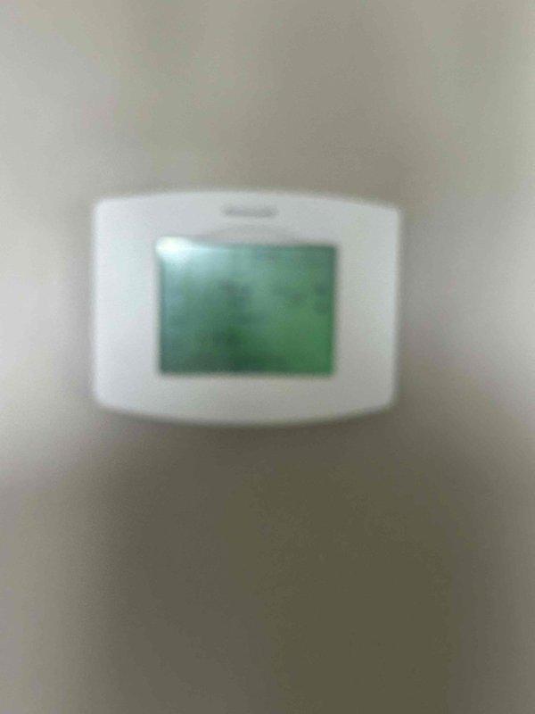 Conducted on-site evaluation for complete HVAC system replacement. Assessed existing outdoor condensing unit and indoor thermostat to determine specifications for new equipment installation. Documented current system configuration including exterior unit placement on concrete pad with electrical conduit routing and interior climate control setup. Provided comprehensive replacement estimate for full system upgrade.