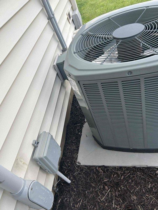 Conducted on-site evaluation for complete HVAC system replacement. Assessed existing outdoor condensing unit and indoor thermostat to determine specifications for new equipment installation. Documented current system configuration including exterior unit placement on concrete pad with electrical conduit routing and interior climate control setup. Provided comprehensive replacement estimate for full system upgrade.