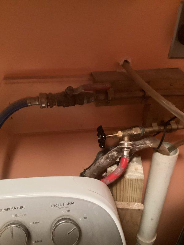 Completed plumbing repairs as quoted, coordinating with municipal water shut-off to safely perform the work. Installed new shut-off valve with brass fittings and replaced deteriorated supply lines with updated flexible connections. Upgraded water heater supply plumbing including installation of sediment trap, red-handled emergency shut-off valve, and proper PVC drainage configuration to ensure code compliance and system longevity.