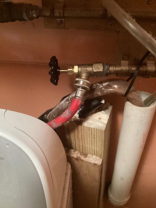 Completed plumbing repairs as quoted, coordinating with municipal water shut-off to safely perform the work. Installed new shut-off valve with brass fittings and replaced deteriorated supply lines with updated flexible connections. Upgraded water heater supply plumbing including installation of sediment trap, red-handled emergency shut-off valve, and proper PVC drainage configuration to ensure code compliance and system longevity.