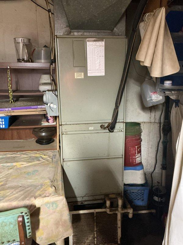 Conducted on-site evaluation for HVAC system replacement following previous service call that identified critically low refrigerant levels in existing unit. Assessed current equipment installation in utility space, documented existing furnace/air handler configuration and electrical panel setup. Provided comprehensive replacement system quote to customer for complete HVAC system upgrade.
