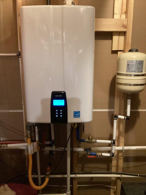 Performed routine maintenance flush on Navien tankless water heater in 3-year-old residential installation. Upon arrival, reviewed unit's diagnostic history which displayed error codes E003-00 and E15-03 on the digital control panel. Completed descaling flush procedure using isolation valves and verified proper operation of all inlet/outlet connections, gas supply lines, and expansion tank. Unit restored to normal operating parameters with error codes cleared.