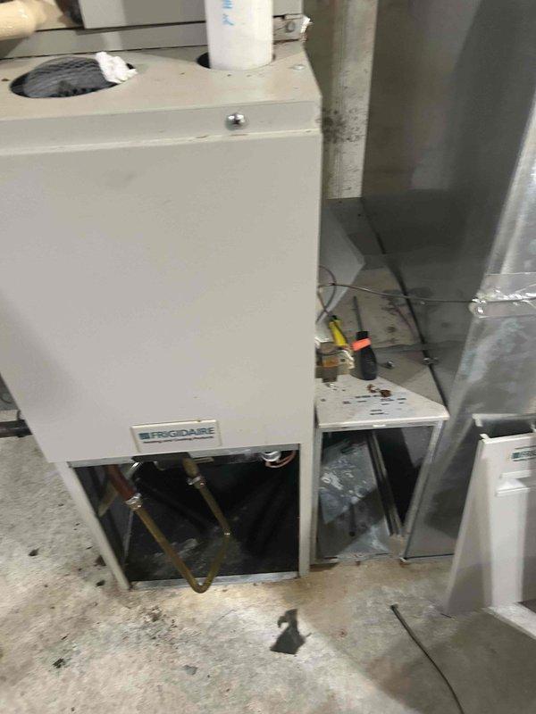 Performed comprehensive site assessment of existing Frigidaire HVAC system located in basement mechanical room to provide equipment replacement estimate. Documented current air handler configuration, including accessible copper refrigerant lines, electrical connections, and ductwork routing. Evaluated installation space constraints, concrete floor conditions, and access requirements through utility room entry point. Photographed equipment specifications, mechanical components, and surrounding infrastructure to develop accurate replacement proposal and ensure proper sizing for new system installation.