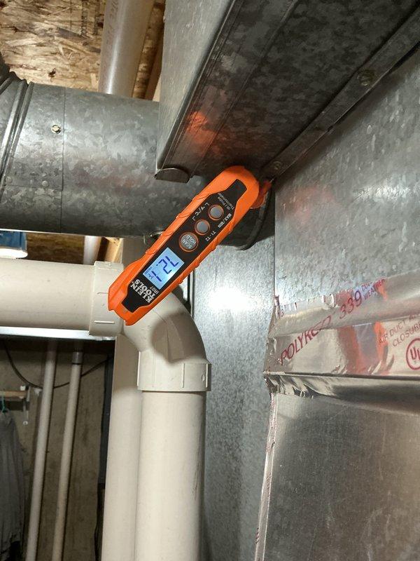 Responded to no cooling complaint on residential HVAC system. Upon arrival, performed system diagnostics and pressure testing using digital manifold gauges. Conducted leak test on refrigerant system which passed with 0.0% pressure drop over 15-minute test period at 353 psig, confirming system integrity. Verified proper airflow and ductwork configuration in basement mechanical area. System restored to normal cooling operation with all parameters within manufacturer specifications.