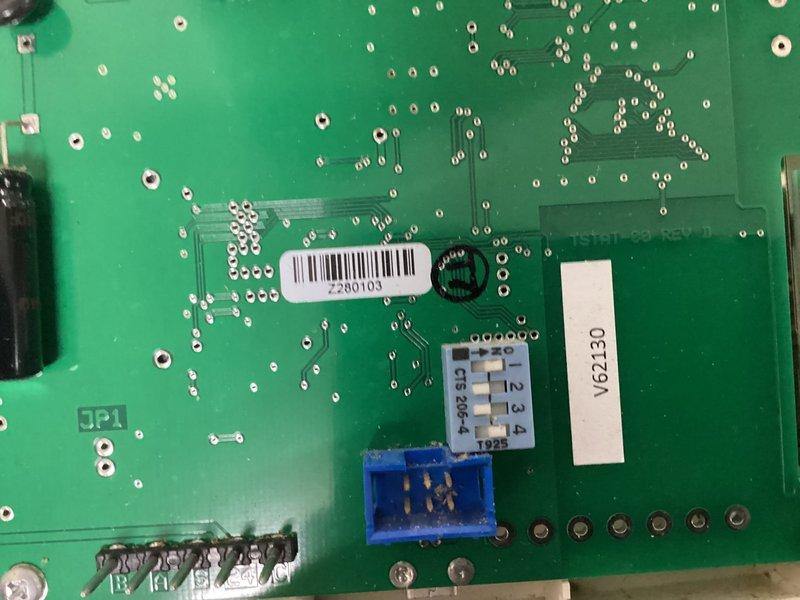 Responded to no-power condition on AAON kitchen unit. Upon arrival, confirmed unit was completely non-responsive with no display activity at wall-mounted control panel. Inspected control board and identified failed circuit board component preventing system operation. Documented existing circuit board condition showing barcode 2280103 and component markings. Unit required control board replacement to restore functionality.