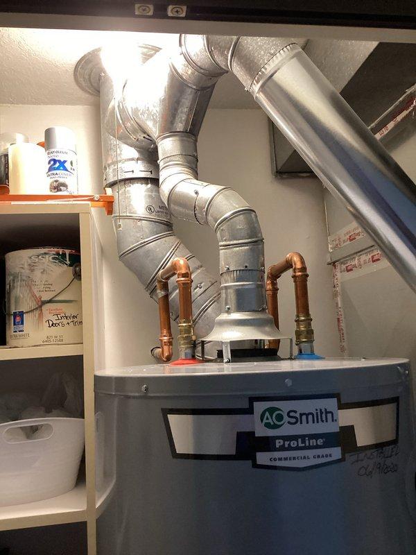 Responded to service call for strong sulfur odor in hot water from A.O. Smith ProLine commercial grade water heater installed in August 2020. Performed comprehensive maintenance service including anode rod inspection and replacement to address bacterial sulfate contamination causing hydrogen sulfide gas production. Drained tank completely and performed thorough flush to remove sediment buildup and mineral deposits from tank bottom. Inspected all copper supply lines, shut-off valves, and pressure relief valve for proper operation. Verified temperature and pressure settings within manufacturer specifications. Tested hot water quality post-service to confirm elimination of sulfur smell. Unit returned to normal operation with improved water quality and extended service life expected from preventative maintenance performed.