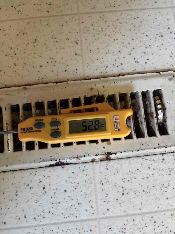 Completed scheduled prepaid cooling system maintenance visit. Performed standard cooling season inspection including verification of supply air temperature at floor register measuring 52.8°F, indicating proper system cooling operation. Inspected outdoor condensing unit electrical components including contactor, capacitor, and low voltage wiring connections; all components found secure and functioning within normal parameters.
