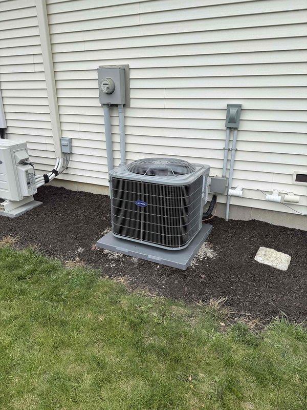 Completed full HVAC system replacement including installation of Carrier Infinity Series 98% AFUE modulating gas furnace with LP conversion kit, Carrier Comfort Series single-stage air conditioner, evaporator coil, and Infinity System Controller with WiFi capability. Installed Honeywell 4" media air cleaner and reconnected all existing supply and return ductwork to new equipment in basement utility area. Removed and recycled old HVAC equipment, then set outdoor condenser unit on new 2" PVC pad with pea gravel base against exterior wall. Flushed, pressure tested, and reconnected to existing refrigerant line set. Installed floor protection during work and cleaned installation areas upon completion. Registered all equipment warranties and provided system operation explanation including thermostat programming and controls. All work performed to code with required permits obtained.