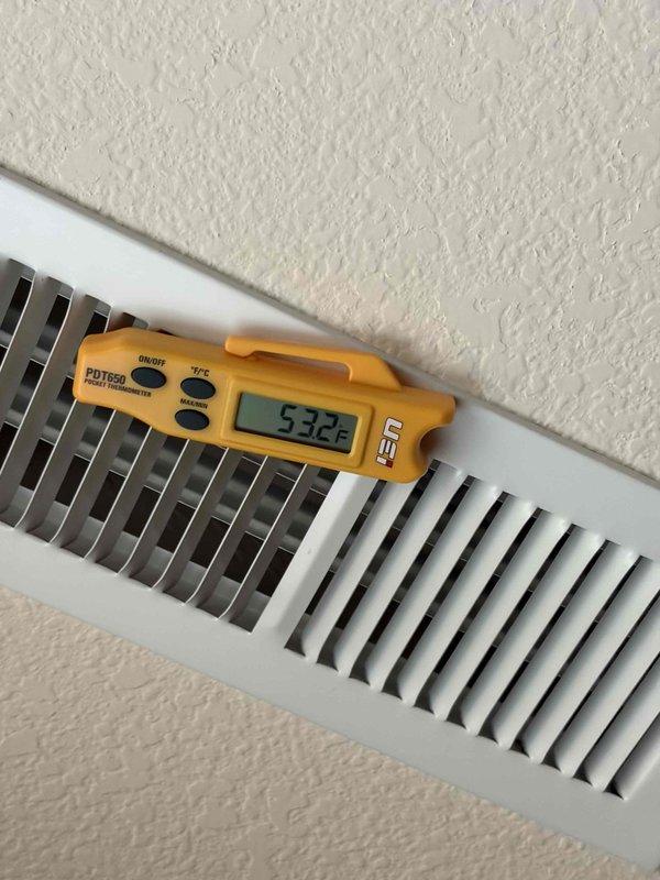 Completed routine air conditioning maintenance on residential cooling system. Performed comprehensive inspection of outdoor condenser unit, verified proper operation of compressor and condenser fan, checked refrigerant lines and service valves for leaks, and measured supply air temperature at 53.2°F confirming adequate cooling performance. All components operating within normal parameters; system ready for continued service through current membership period expiring August 2026.