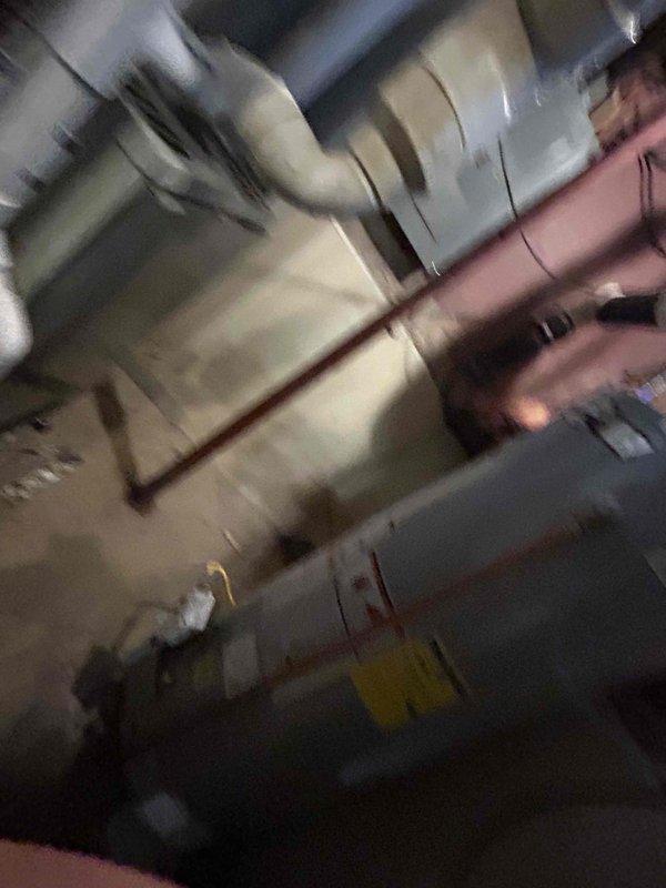 Conducted comprehensive site assessment for HVAC system replacement at residential property. Documented existing equipment including outdoor condensing unit with electrical disconnect and indoor water heater/utility equipment in basement area. Evaluated current system configuration, electrical connections, and installation conditions to provide accurate replacement estimate for complete HVAC system upgrade.