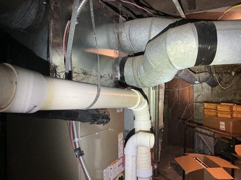 Conducted on-site evaluation of existing single-zone HVAC system to provide estimate for adding supplemental zone to improve second-floor cooling capacity. Assessed current furnace, air handler, and ductwork configuration in basement mechanical room. Documented existing system layout including main supply trunk lines, flexible ductwork runs, and available space for potential zone damper installation and additional supply branches to serve upstairs areas.
