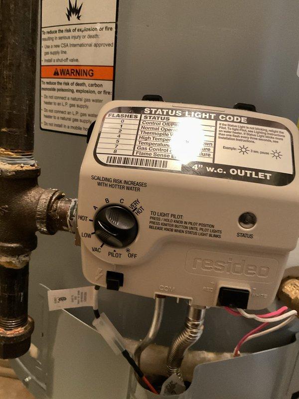 Replaced leaking 50-gallon residential water heater in utility room under warranty coverage. Removed failed unit and installed new A.O. Smith water heater with Honeywell gas control valve, verified all plumbing connections, tested gas lines for leaks, and confirmed proper operation of pilot light and burner assembly. Unit is functioning correctly with appropriate temperature settings and all safety controls operational.