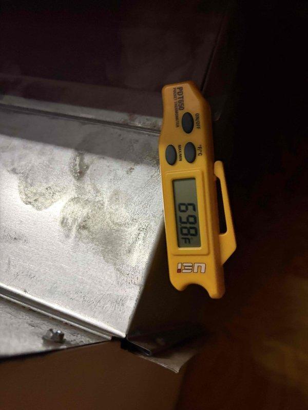 Completed first prepaid cooling system maintenance visit after rescheduling due to previous service delays. Performed standard system diagnostics and temperature measurements on HVAC equipment and ductwork, documenting supply air temperatures and system performance readings with digital instrumentation.