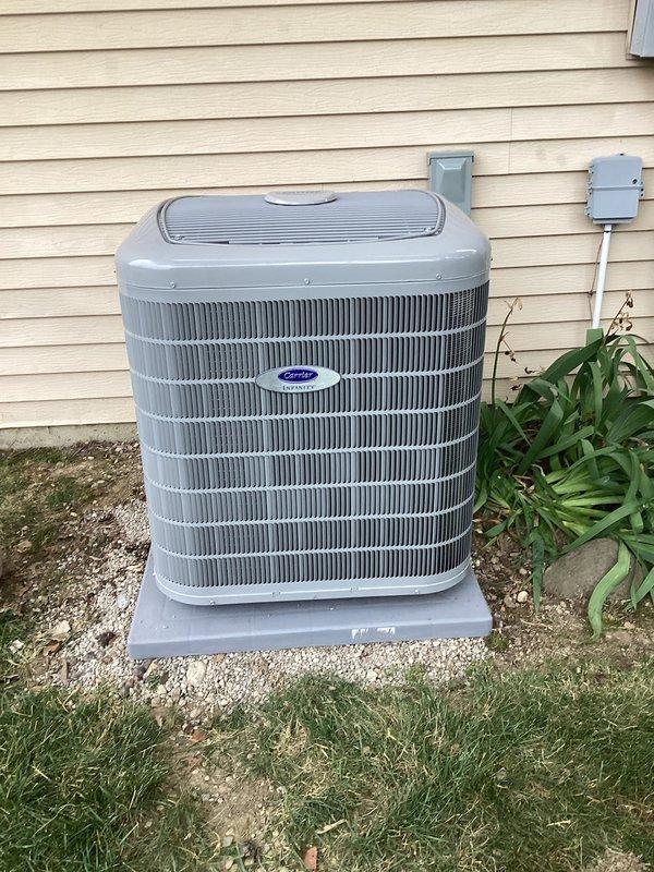 Completed full HVAC system upgrade consisting of Carrier 26VNA136W003 Infinity Series variable-speed air conditioner and Carrier CVAVA4217XMA evaporator coil. Removed and recycled existing equipment, then installed new outdoor condenser unit on 2" PVC pad with pea gravel base. Reconnected to existing line set after flushing and pressure testing for leaks. Installed new electrical disconnect and whip for outdoor unit power supply. Mounted evaporator coil in existing plenum and reconnected to supply and return ductwork. Connected condensate drainage system using PVC piping. Installed new thermostat and integrated outdoor temperature sensor for optimal system performance. Performed system startup, verified proper refrigerant charge, airflow, and electrical connections. Conducted operational testing to ensure variable-speed functionality and proper cycling. Provided homeowner with system operation training and thermostat programming instructions. Completed post-installation quality assuran