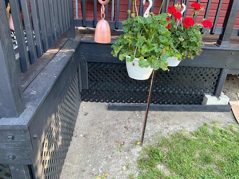 Responded to customer concern regarding furnace flue exhaust odor detected on outdoor porch area. Inspected furnace flue termination location beneath deck structure and assessed ventilation configuration. Installed new air filtration media and provided recommendations for flue extension or relocation to redirect combustion exhaust away from occupied outdoor living spaces.