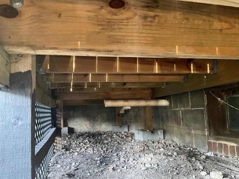 Responded to customer concern regarding furnace flue exhaust odor detected on outdoor porch area. Inspected furnace flue termination location beneath deck structure and assessed ventilation configuration. Installed new air filtration media and provided recommendations for flue extension or relocation to redirect combustion exhaust away from occupied outdoor living spaces.