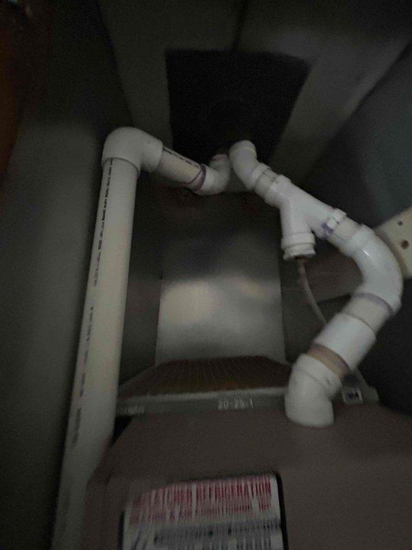 Provided comprehensive estimate for complete HVAC system replacement including furnace, air conditioning unit, and ductwork replacement following damage requiring remediation. Inspected existing York air handler unit and associated PVC condensate drainage system in utility closet, finding no visible water damage or leakage in accessible areas beneath the structure. Recommended smoke testing of drainage system to identify potential air leaks, with customer approving procurement of materials and scheduling return visit with two technicians to perform diagnostic smoke test using tall ladder and 3" fernco coupling for proper system evaluation.