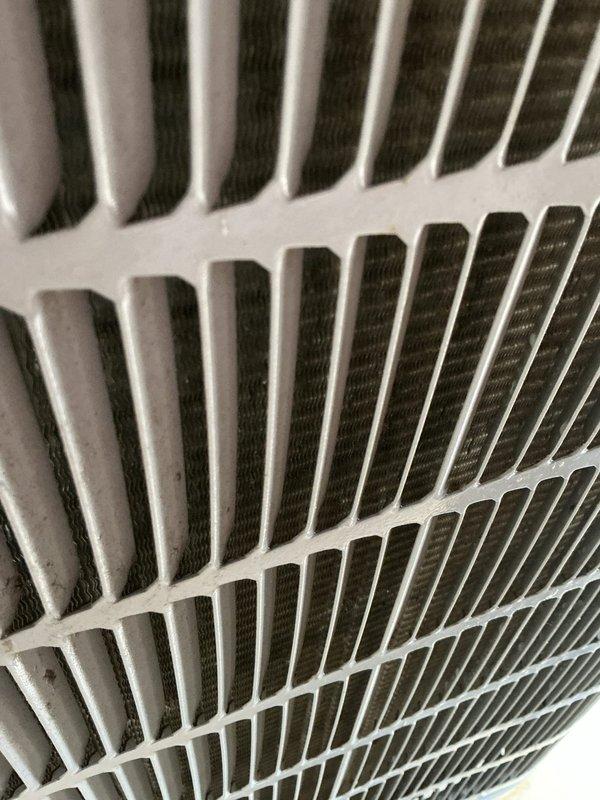 Completed preventive maintenance on aging cooling system over 10 years old. Inspected air handler unit and found heavily soiled air filter with significant dust and debris accumulation restricting airflow. Replaced dirty filter with new unit to restore proper system efficiency and air quality.