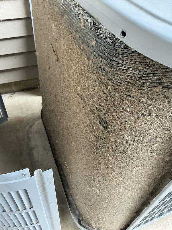 Completed preventive maintenance on aging cooling system over 10 years old. Inspected air handler unit and found heavily soiled air filter with significant dust and debris accumulation restricting airflow. Replaced dirty filter with new unit to restore proper system efficiency and air quality.