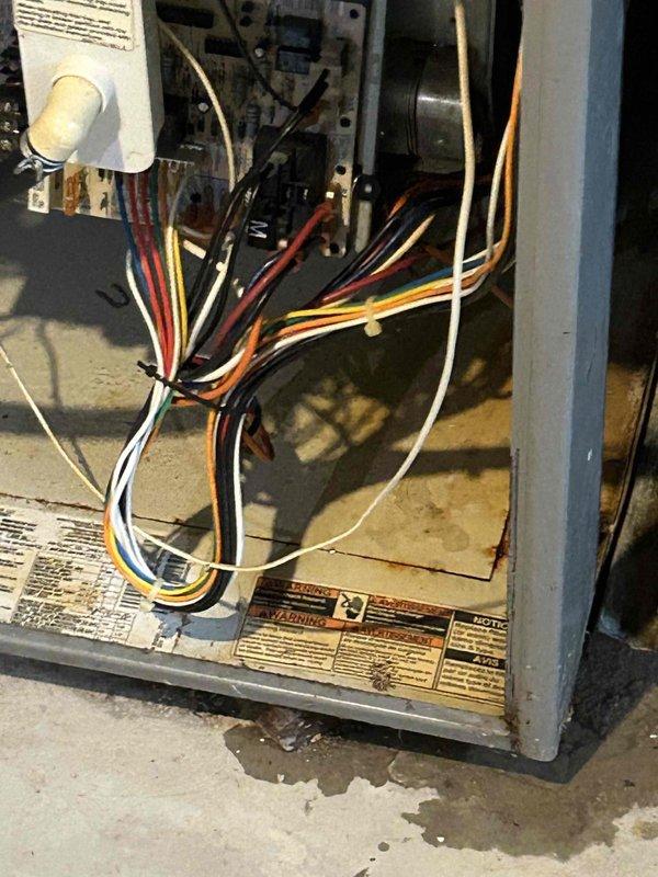 Tech lead Alex conducted a comprehensive HVAC system replacement estimate and documentation. Detailed photographic assessment was performed of the existing unit's internal components, including electrical wiring configurations, blower motors, control boards, and condensate management systems. The inspection revealed an aging system with visible wear, accumulated debris, and potential maintenance concerns requiring full system replacement evaluation.