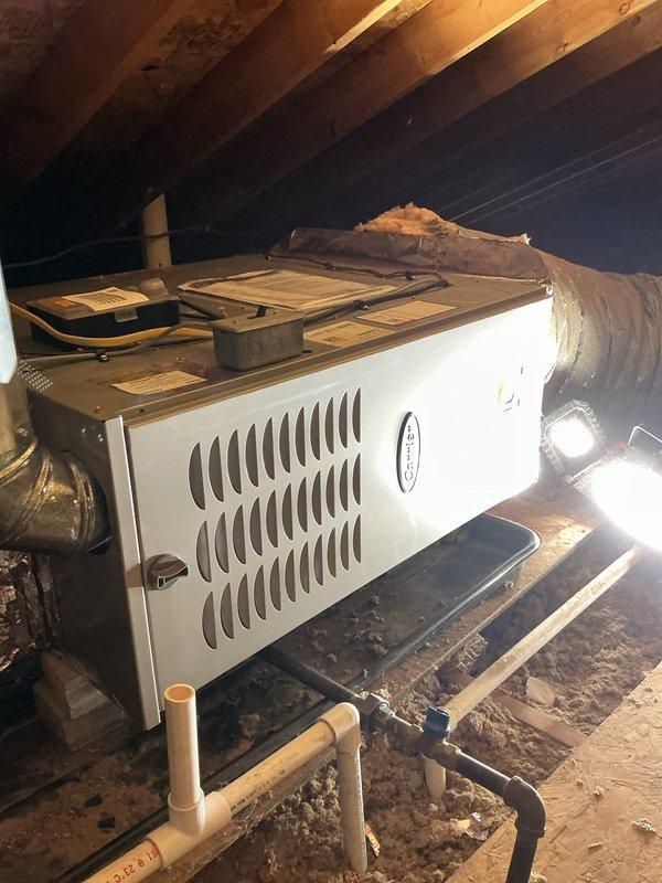 Completed full HVAC system replacement in horizontal attic configuration, installing Carrier 26SCA424N003 single-stage air conditioner, CVAVA3017XMA evaporator coil, and 58TP0B070V14-12 two-stage non-condensing gas furnace. Reconnected to existing line set after flushing and pressure testing for proper refrigerant flow, installed safety auxiliary drain pan with wet switch for overflow protection, and reconnected existing supply and return ductwork. Removed and recycled old equipment, provided system operation explanation, completed post-install walk-through and quality assurance inspection, registered manufacturer warranties, and delivered home protection package with floor savers and complete cleanup of installation area.