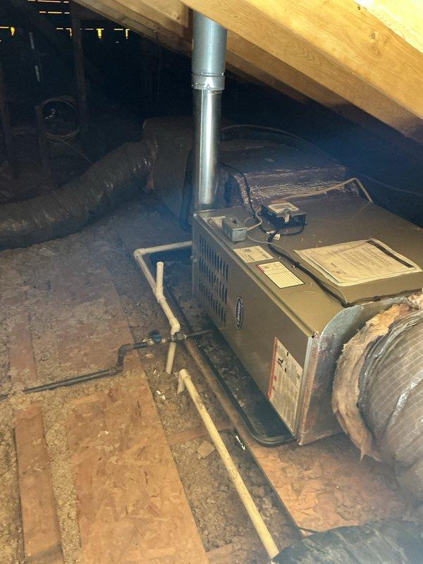 Completed full HVAC system replacement in horizontal attic configuration, installing Carrier 26SCA424N003 single-stage air conditioner, CVAVA3017XMA evaporator coil, and 58TP0B070V14-12 two-stage non-condensing gas furnace. Reconnected to existing line set after flushing and pressure testing for proper refrigerant flow, installed safety auxiliary drain pan with wet switch for overflow protection, and reconnected existing supply and return ductwork. Removed and recycled old equipment, provided system operation explanation, completed post-install walk-through and quality assurance inspection, registered manufacturer warranties, and delivered home protection package with floor savers and complete cleanup of installation area.