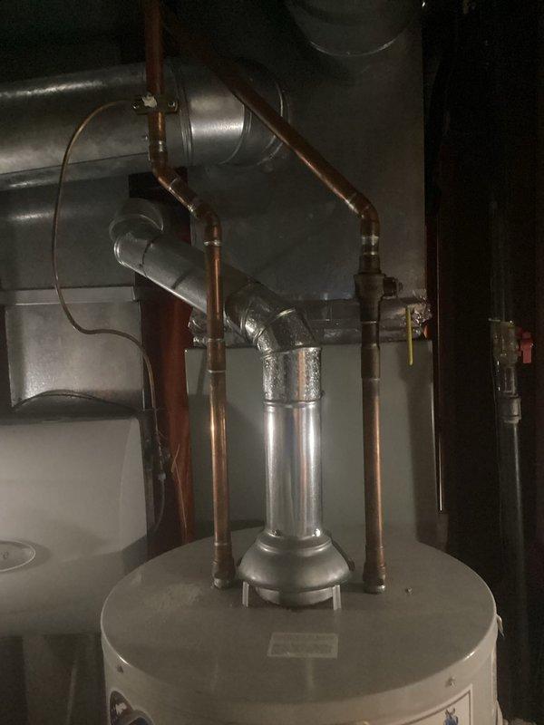 Provided estimate for replacement of gas-fired tank-style water heater with pilot light failure. Existing unit located in basement showed signs of age and pilot would not remain lit, indicating likely thermocouple or gas valve failure. Assessed current installation including copper supply piping, venting configuration, and gas line connections to determine scope of replacement work.