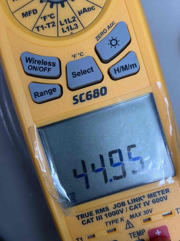Performed seasonal air conditioning tune-up including system cleaning and comprehensive operational check. Utilized digital multimeter to verify electrical readings and measured system temperatures, confirming unit operating within manufacturer specifications at 40.5°F. All components inspected and system left in proper working condition.