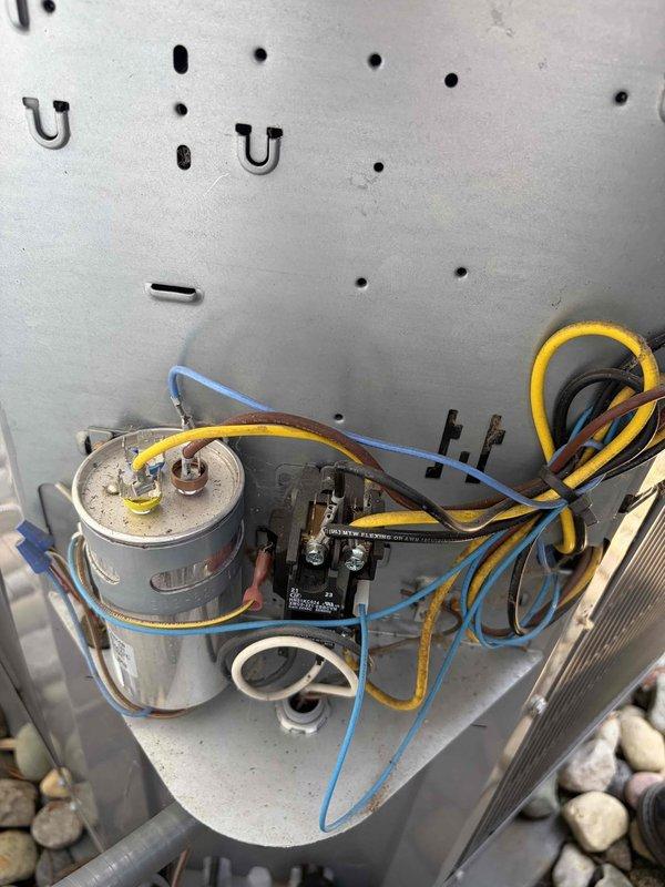 Completed preventive maintenance service on residential air conditioning system. Performed comprehensive inspection of outdoor condensing unit, including examination of electrical components, capacitor, contactor, and wiring connections. All electrical terminals were found secure with proper connections intact. Verified capacitor condition and contactor operation. Inspected condenser coil and confirmed unit is operating within normal parameters. System tested and left in proper working condition.