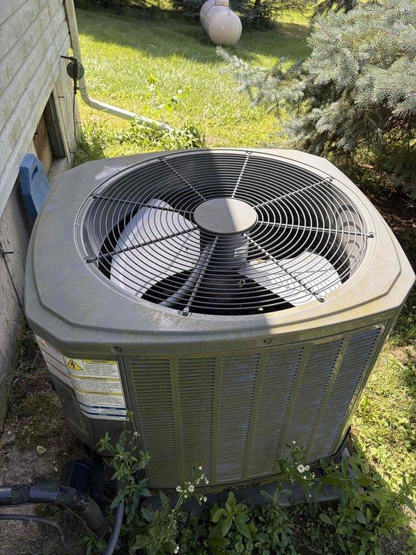 Completed comprehensive AC tune-up on residential condensing unit. Performed system diagnostics including capacitor testing with digital multimeter, verifying proper electrical values and component functionality. Unit operating within normal parameters with all components functioning properly.