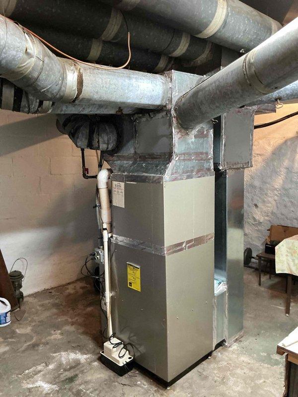 Completed annual air conditioning maintenance on residential Carrier condenser unit and associated indoor HVAC system. Performed comprehensive system inspection including evaluation of outdoor condenser components, heat exchanger coils, refrigerant lines, and indoor furnace connections. Verified proper operation of all equipment, confirmed adequate airflow through ductwork system, and documented system condition with photographic records showing unit in good working order with no immediate service needs identified.