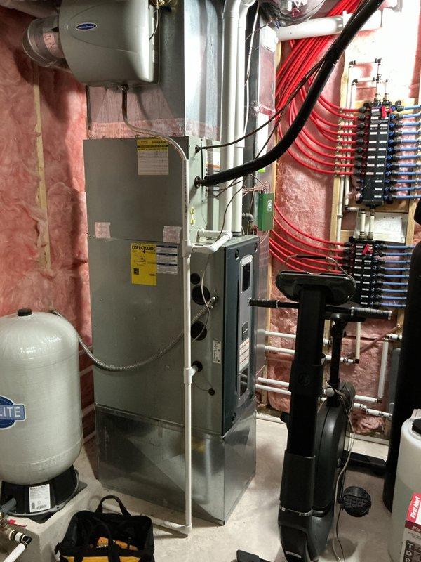 Completed comprehensive tune-up service on two residential HVAC systems as scheduled. Performed standard maintenance procedures including filter inspection, coil cleaning, refrigerant level verification, electrical connection checks, and system performance testing on both units. All equipment operating within normal parameters upon completion, with air handler and associated humidification components functioning properly.