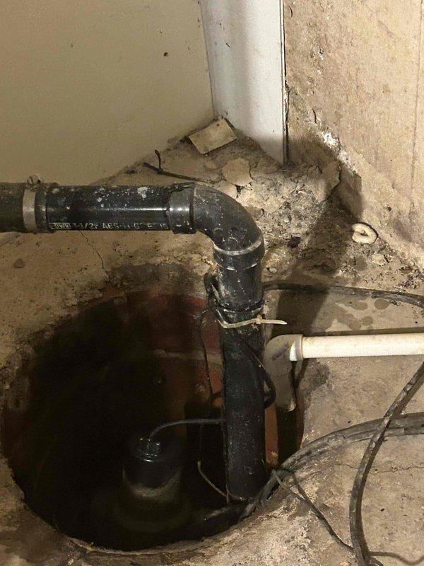 Conducted comprehensive HVAC system assessment for residential property following referral and previous service recommendation for unit replacement. Evaluated existing Goodman furnace installation in basement utility area, noting age and operational condition of current equipment. Assessed ductwork configuration including white insulated supply ducts and metallic flexible ducting connections. Examined electrical components and wiring associated with existing system. Inspected basement installation environment, documenting floor conditions, concrete surfaces, and utility pipe locations that may impact equipment placement. Reviewed both air conditioning and furnace replacement options to provide customer with complete system upgrade estimates. Photographed existing equipment installation, ductwork layout, and surrounding area conditions for replacement planning purposes. Provided detailed pricing options for air conditioning replacement as primary need, with additional furnace replacemen