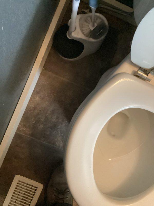 Responded to a leak at the base of a first-floor half bath toilet. Upon inspection, identified water seepage around the toilet base onto the tile flooring. Removed and reset the toilet with a new wax ring seal to eliminate the leak at the floor connection. Tested the fixture after reinstallation to confirm proper seal and no further water discharge at the base.