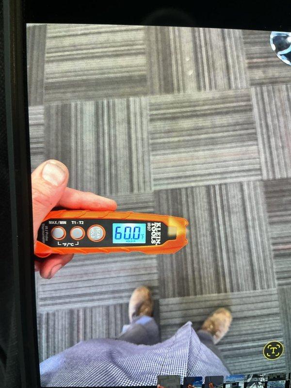 Responded to no cooling complaint on front commercial rooftop unit. Accessed rooftop packaged HVAC system, performed diagnostic testing with multimeter showing 600V reading, and inspected internal components with access panels open. Verified rear unit operating normally and restored cooling operation to affected front unit.