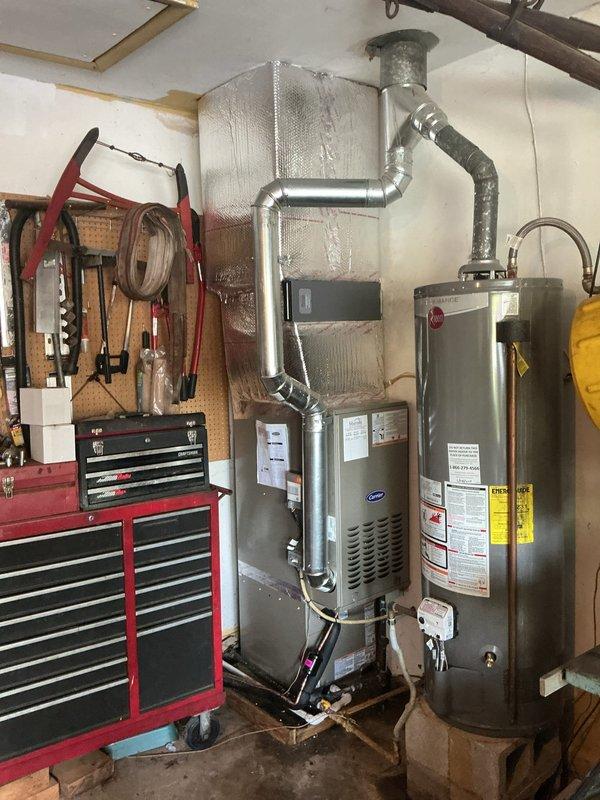 Completed full HVAC system replacement including installation of Carrier 26SCA424N003 Comfort Series single-stage air conditioner, Carrier CVAVA3017XMA evaporator coil, and Carrier 58SB0B070M17-12 Comfort single-stage gas furnace with 70,000 BTU capacity. Removed and recycled existing equipment, then positioned new outdoor condenser unit on vibration-dampening platform with proper clearances. Installed new electrical disconnect and whip for outdoor unit. Reconnected to existing refrigerant line set after performing complete flush and pressure test to verify system integrity. Mounted evaporator coil in air handler cabinet and connected to furnace system. Installed Honeywell 4-inch media air cleaner for improved indoor air quality. Reconnected all existing supply and return ductwork to new equipment with proper sealing. Upgraded to Honeywell T6 programmable thermostat with complete wiring and configuration. Installed new condensate drain system with proper pitch and termination. Verified