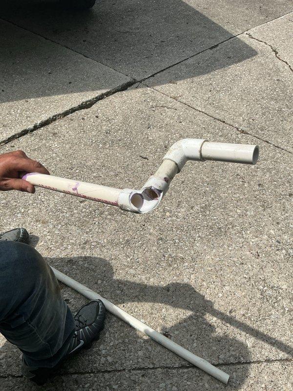 Responded to callback for non-operational AC unit after breaker replacement failed to restore power. Verified attic condensate drain line installation and repositioned condensate pan to prevent water leakage into living space. Inspected rooftop PVC drain line routing and repaired sections with improper connections. Unit restored to operational status with proper drainage confirmed.