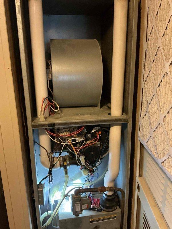 Completed comprehensive cooling system tune-up on residential HVAC unit. Performed full system inspection including blower assembly, motor operation, electrical connections, and gas valve components. Inspected and evaluated air filter condition, verified proper airflow through louvered panels, and ensured all mechanical components within the vertical enclosure were functioning correctly.