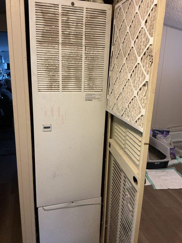 Completed comprehensive cooling system tune-up on residential HVAC unit. Performed full system inspection including blower assembly, motor operation, electrical connections, and gas valve components. Inspected and evaluated air filter condition, verified proper airflow through louvered panels, and ensured all mechanical components within the vertical enclosure were functioning correctly.