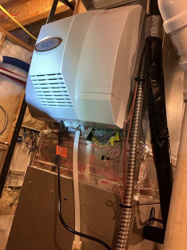 Completed annual AC tune-up on 2-year-old system operating without issues. Performed comprehensive maintenance including inspection of outdoor condensing unit, indoor air handler, and integrated Aprilaire humidifier system. All components tested and verified operating within normal parameters, with appointment reminder scheduled for next year's preventive maintenance.