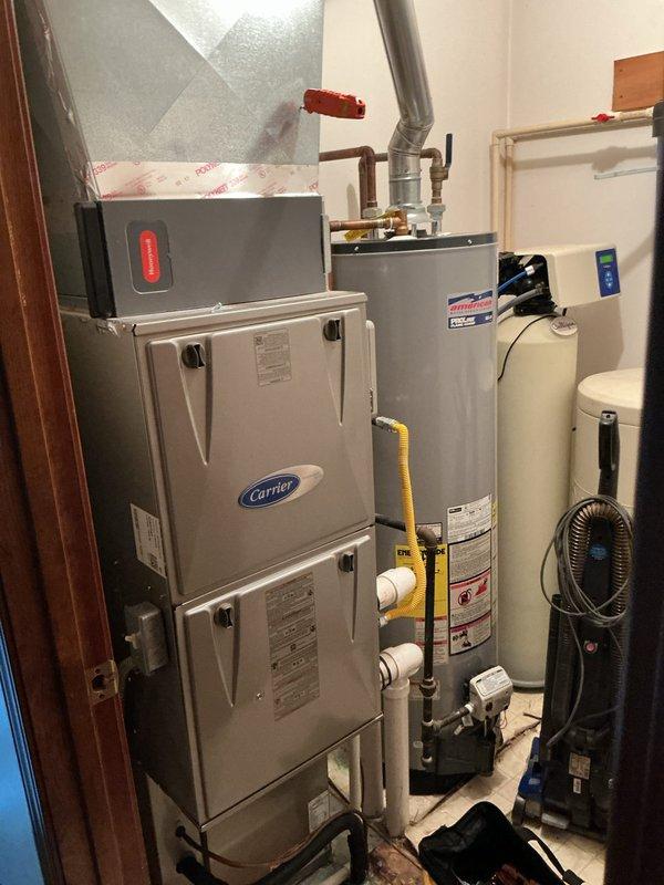 Completed preventative maintenance tune-up on 9-year-old Carrier split system air conditioning unit. Investigated customer complaint of intermittent noise occurring approximately every 10 minutes from outdoor condenser. Performed comprehensive system inspection including indoor furnace/air handler and outdoor condensing unit. Checked electrical connections, refrigerant levels, and operational cycling. Cleaned condenser coils, inspected fan motor and blades for wear or debris causing noise issue. Verified proper airflow, temperature differential, and thermostat operation. System operating within normal parameters at time of service completion.