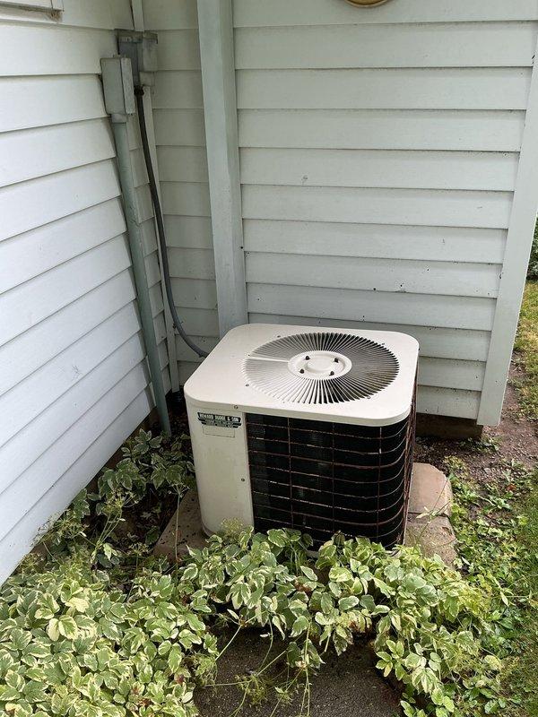 Completed comprehensive AC tune-up on residential split system, including inspection of attic-mounted air handler and outdoor condenser unit. Verified proper operation of all components, checked refrigerant lines, electrical connections, and airflow. Noted vegetation growth around condenser unit that may require clearance for optimal performance and recommended scheduling future heating system maintenance.
