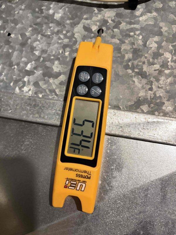 Completed final prepaid cooling maintenance visit on residential HVAC system. Performed standard system inspection and temperature diagnostics, recording supply air temperature of 73.4°F. Upon inspection of outdoor condensing unit, discovered capacitor with severe corrosion and rust deterioration on terminals and top surface, indicating exposure to moisture and age-related failure requiring immediate replacement to prevent system breakdown.