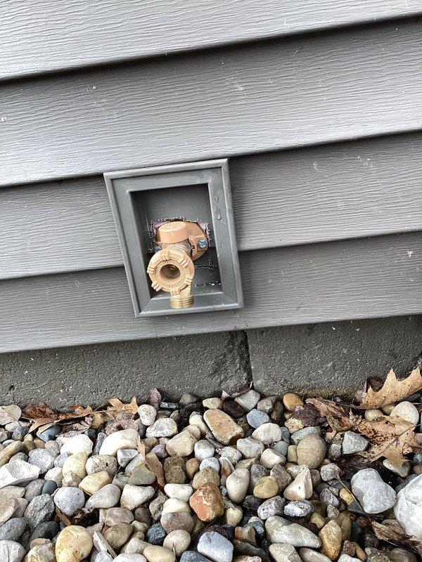 Responded to callback for outdoor plumbing fixtures. Inspected exterior hose bibs and shut-off valve housed in recessed wall panel with brass fittings showing age and wear. Evaluated valve condition and outdoor faucet functionality per owner's request for replacement. Documented current state of fixtures and accessed crawlspace to trace supply lines and assess copper piping connections. Return visit scheduled to complete shut-off valve replacement or repair and install new outdoor faucets as specified by property owner.