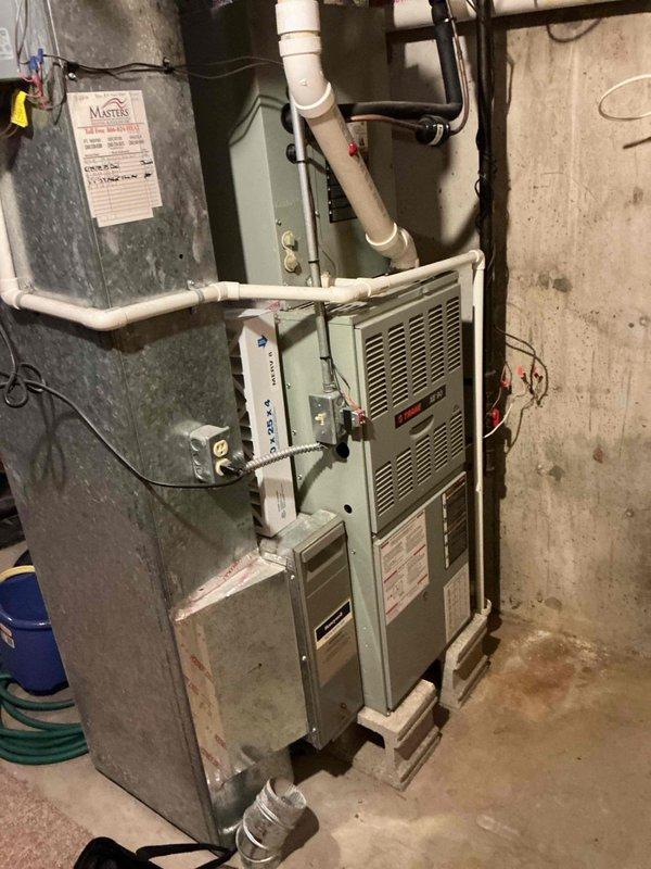 Completed first prepaid cooling maintenance visit on residential HVAC system. Performed comprehensive inspection of furnace unit and cooling components located in basement mechanical room. System found to be in functional condition with minor dust accumulation on equipment and ductwork. Verified proper operation of all accessible components, checked condensate drainage lines, and inspected ductwork connections for secure installation and air sealing.